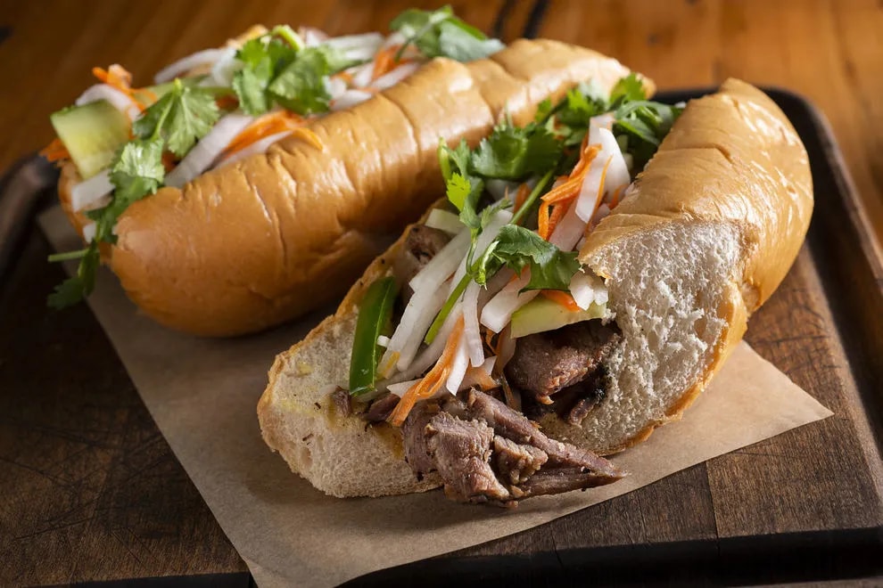 The protein layer may include a mix of Vietnamese cold cuts like cha lua, gio lua, pâté, etc